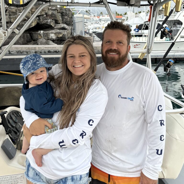 Captain Kevin, Tasha, and their son Kade on the Ocean Blue Kona boat